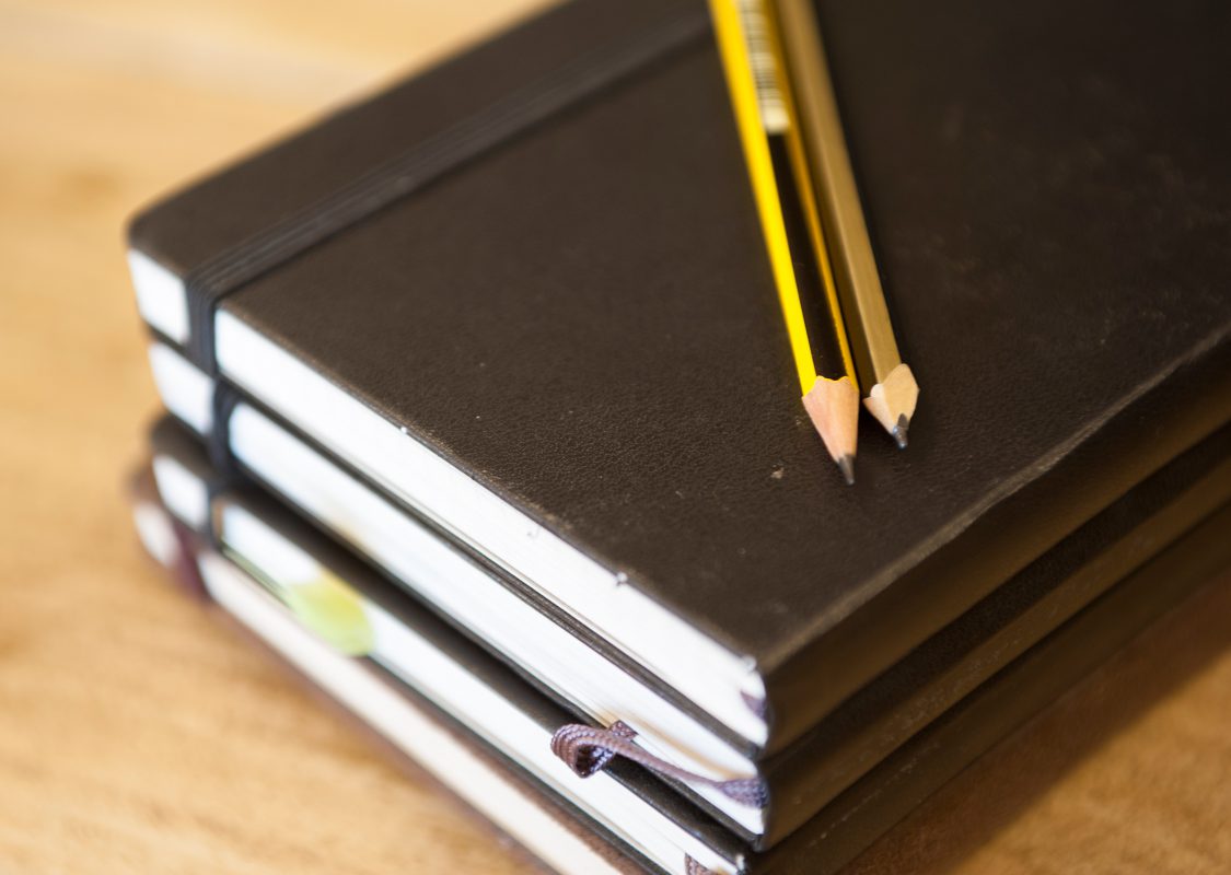 closeup-notebooks-and-pencils