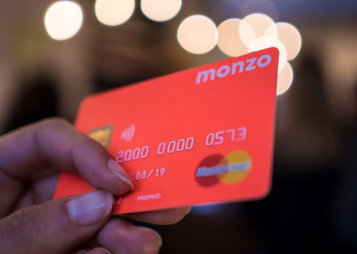 fluorescent orange Monzo credit card